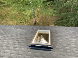 Skylight on an asphalt shingle roof, a common place for roof leaks to start